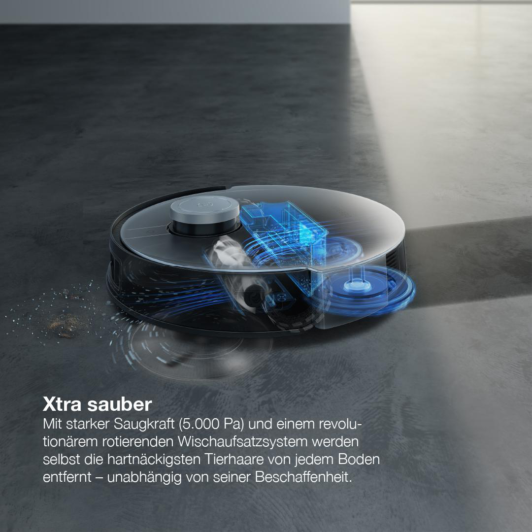Roboter-Staubsauger auf dunklem Boden, mit Text über Saugkraft und Wischsystem.