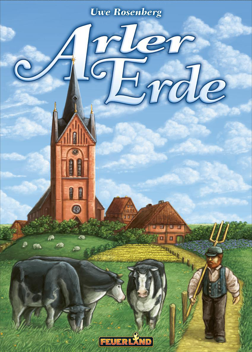 Spielbox mit Kirche, Feldern, Kühen und einem Bauern.