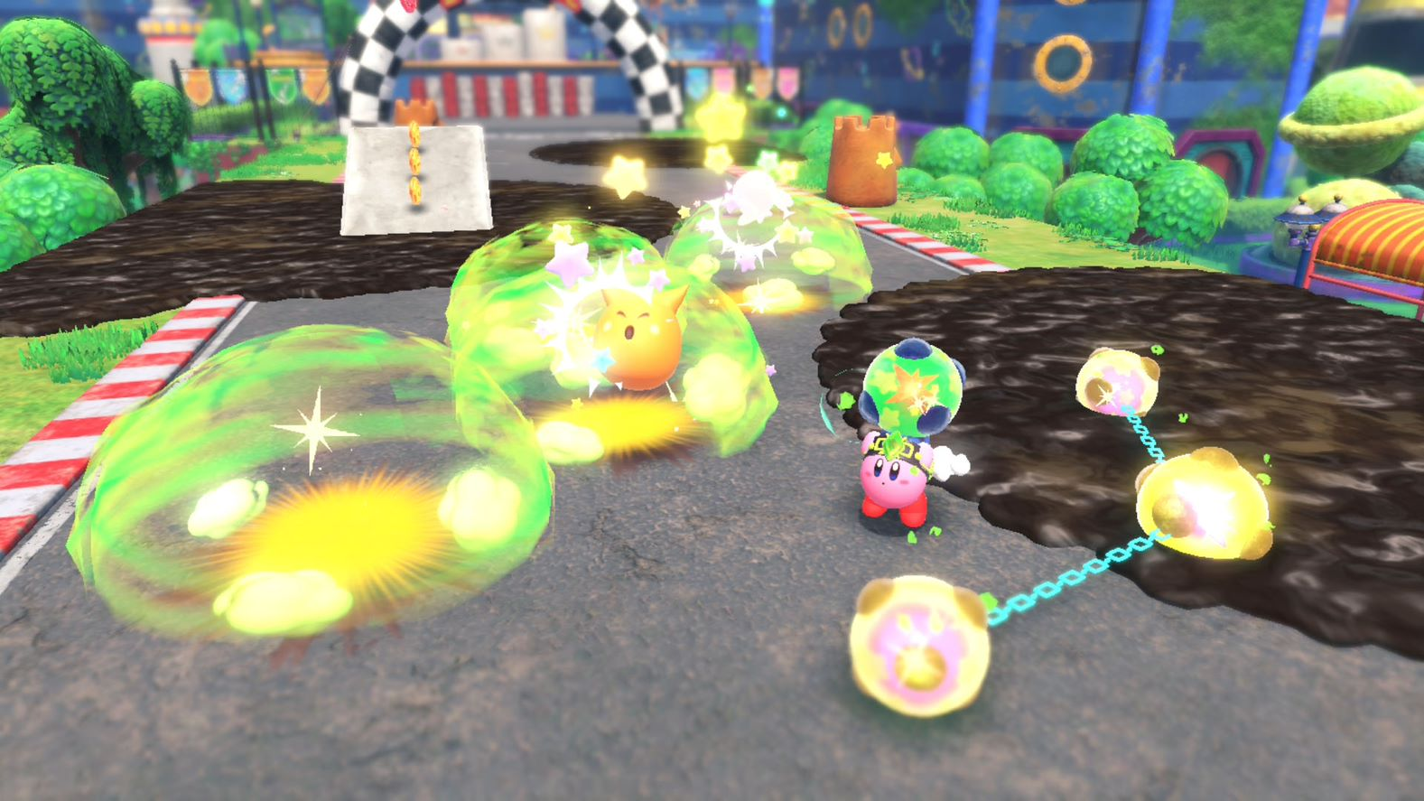 Kirby in een race, omringd door gloeiende bollen en een geblokte vlag op de achtergrond.
