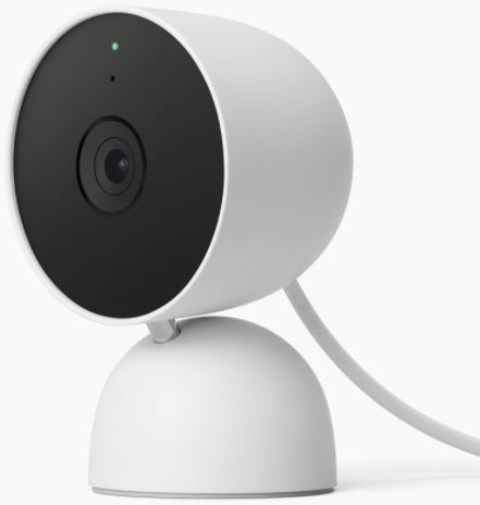 Une caméra Nest blanche est affichée, montrant l'objectif et la lumière verte.