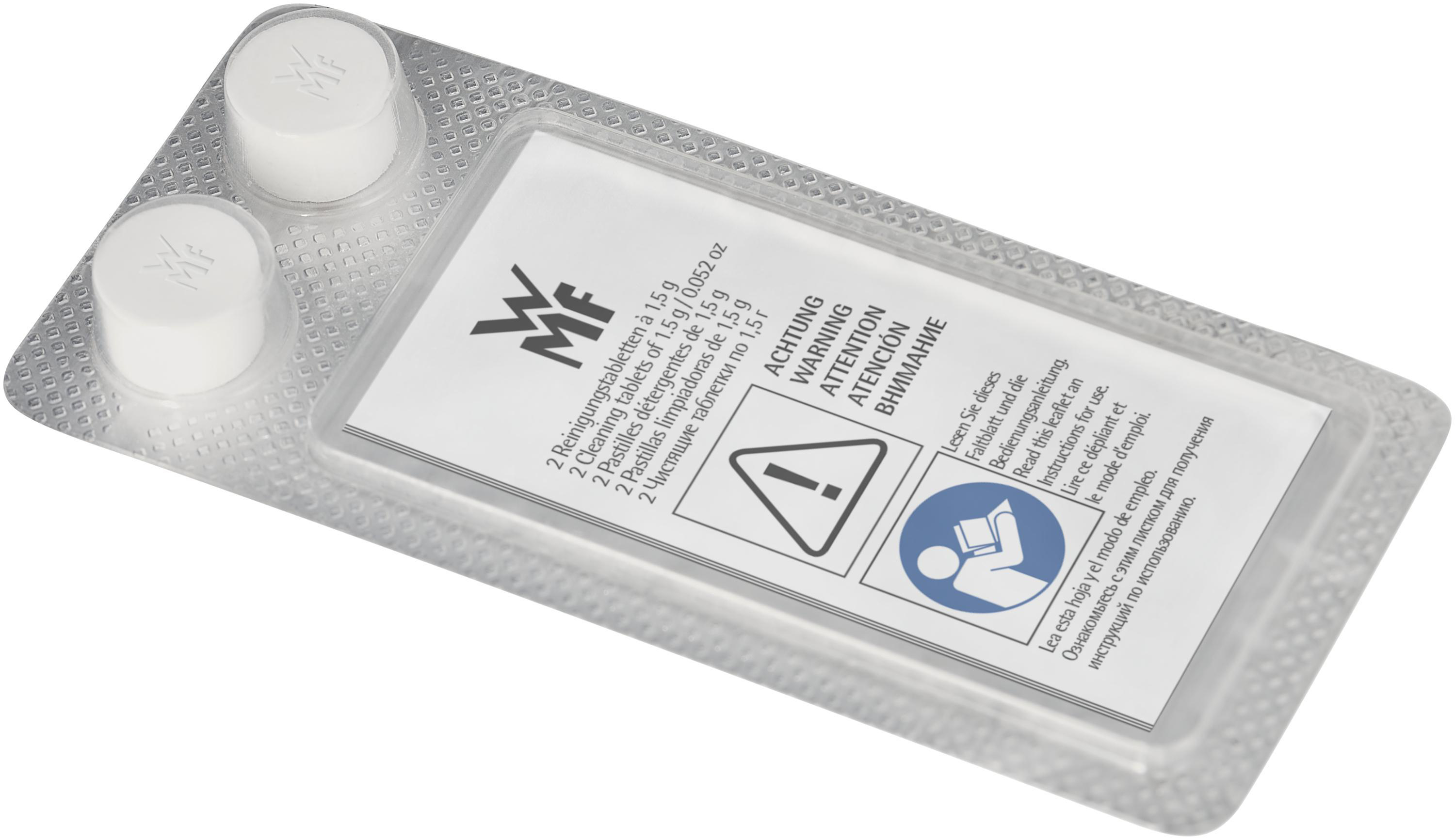 Blisterpackung mit zwei weißen Reinigungstabletten und Anweisungen in mehreren Sprachen.