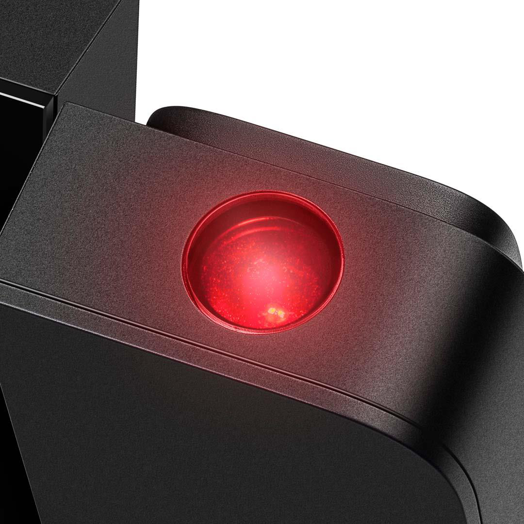 Un objet noir avec un cercle rouge lumineux.