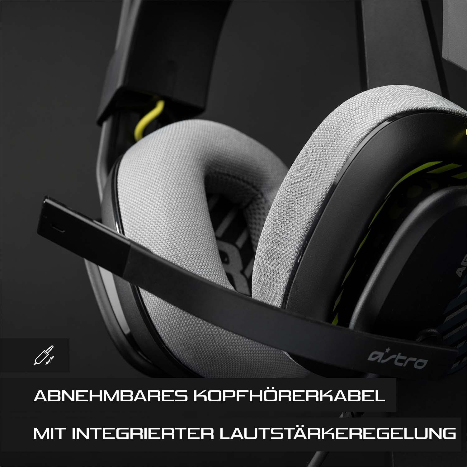 Schwarze und graue Gaming-Kopfhörer. Das Bild konzentriert sich auf Ohrmuschel und Mikrofon.