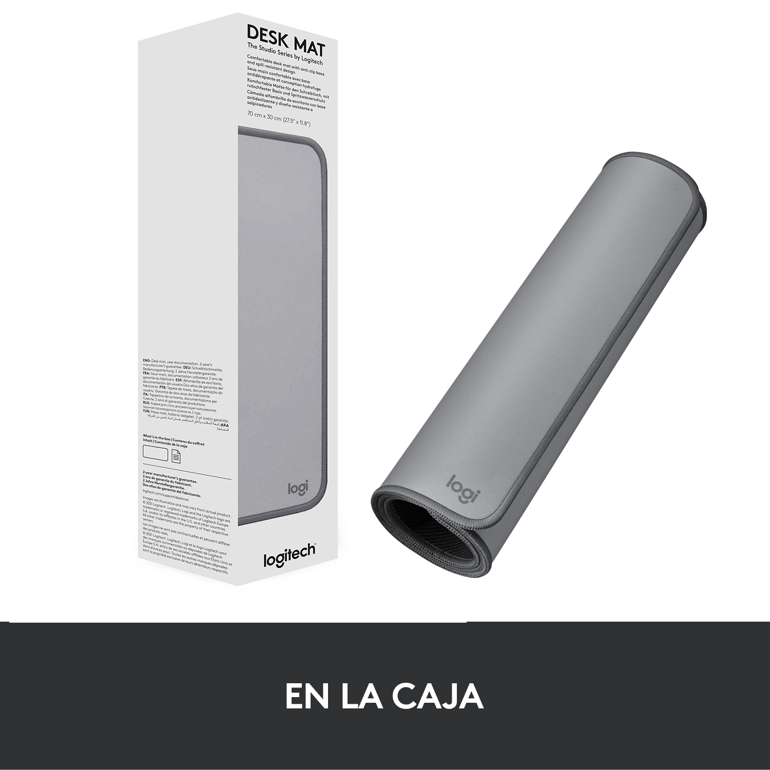 Alfombrilla de escritorio con caja de embalaje, esterilla gris enrollada y caja a la izquierda.