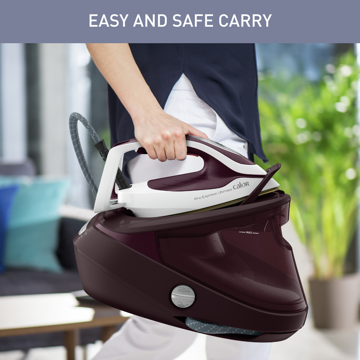 A person holding a burgundy and white steam iron and its burgundy base, with text 'Easy and Safe Carry'.