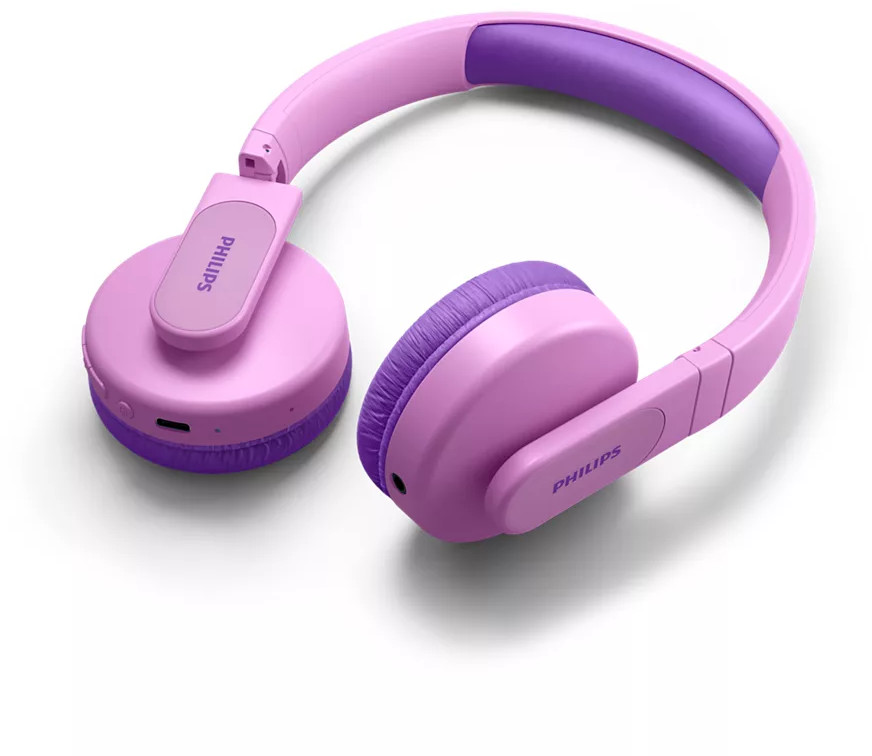 Casque sans fil rose et violet. Sur une surface blanche. 'PHILIPS' sur le côté.