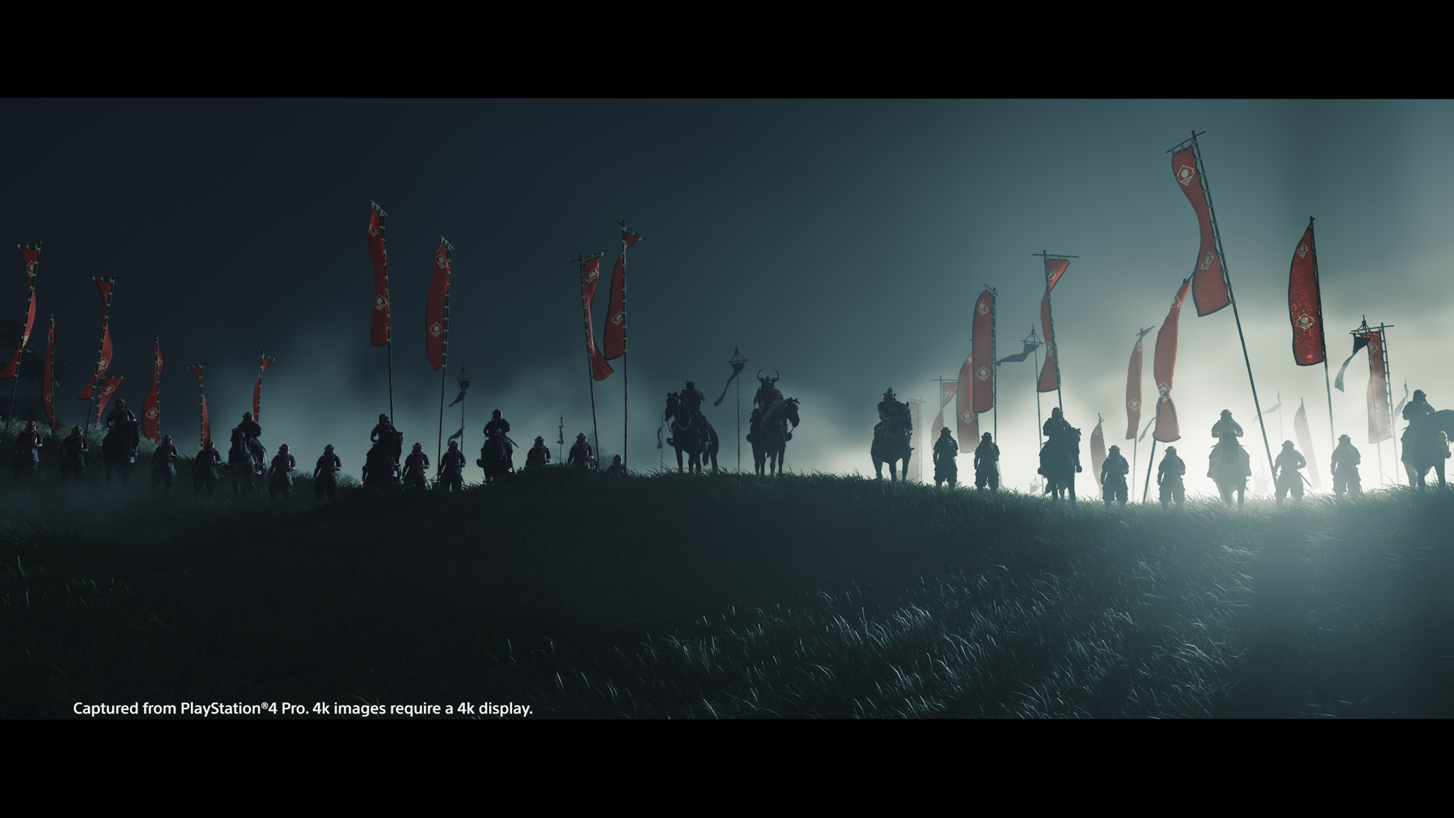 A battle scene with many warriors on horseback and on foot. Red flags wave in the background.