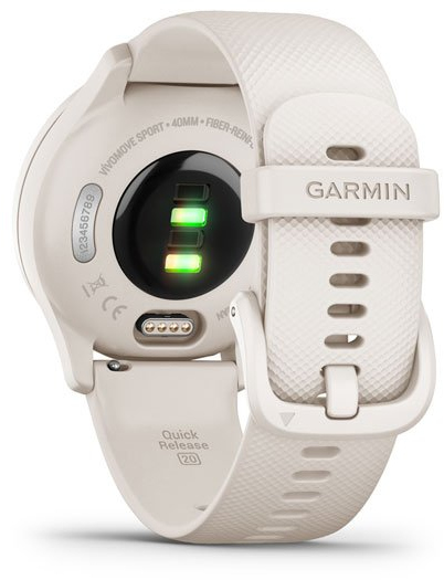 Une montre Garmin crème montre l'arrière avec des capteurs et un bracelet. Le bracelet est blanc.