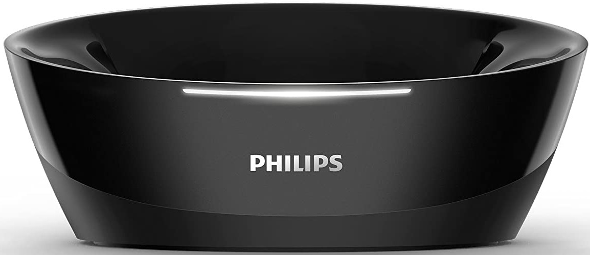 Système audio Philips noir avec un design lisse et incurvé. Le logo Philips est en blanc.
