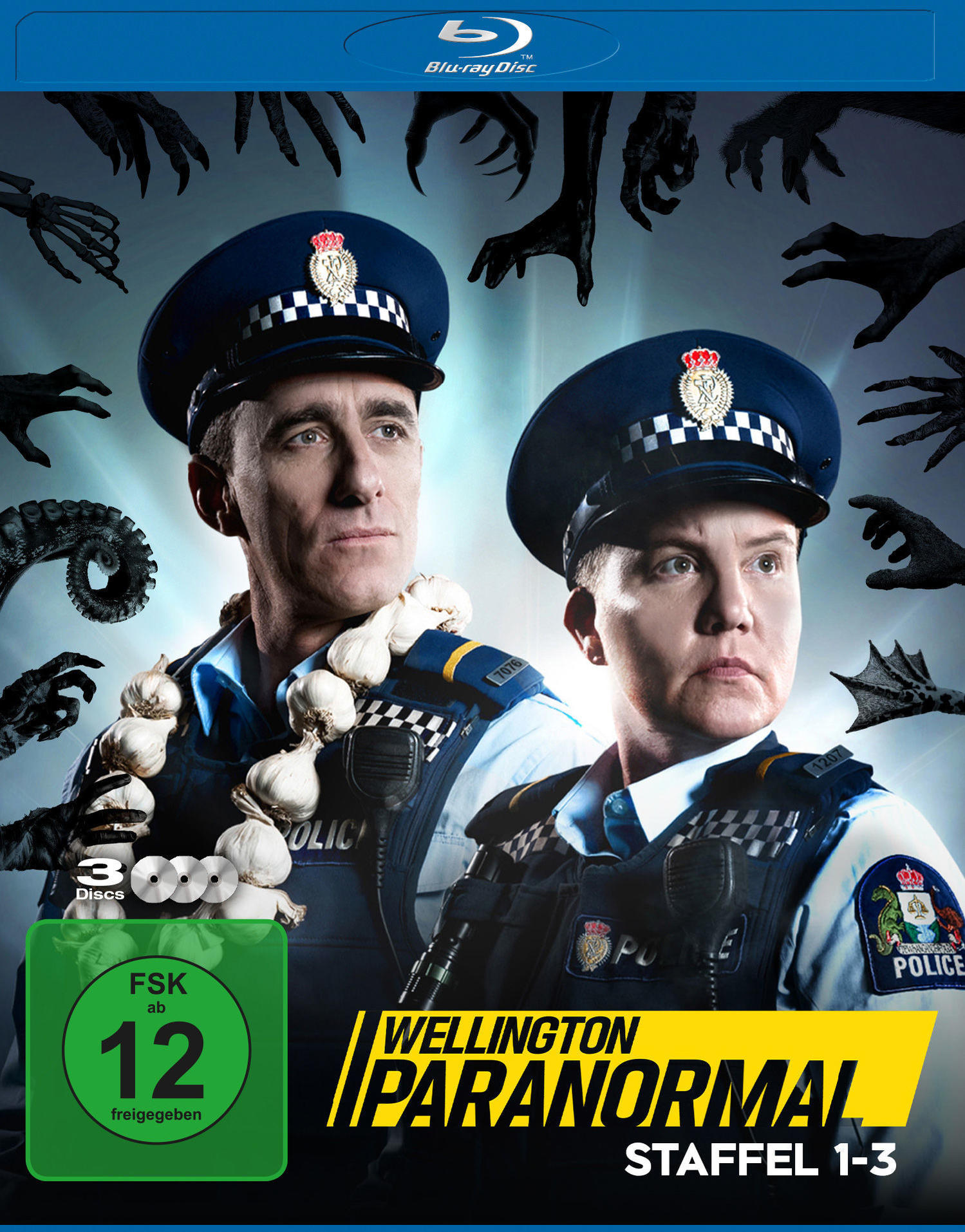 DVD-Cover für 'Wellington Paranormal' mit zwei Polizisten und Monsterhänden.