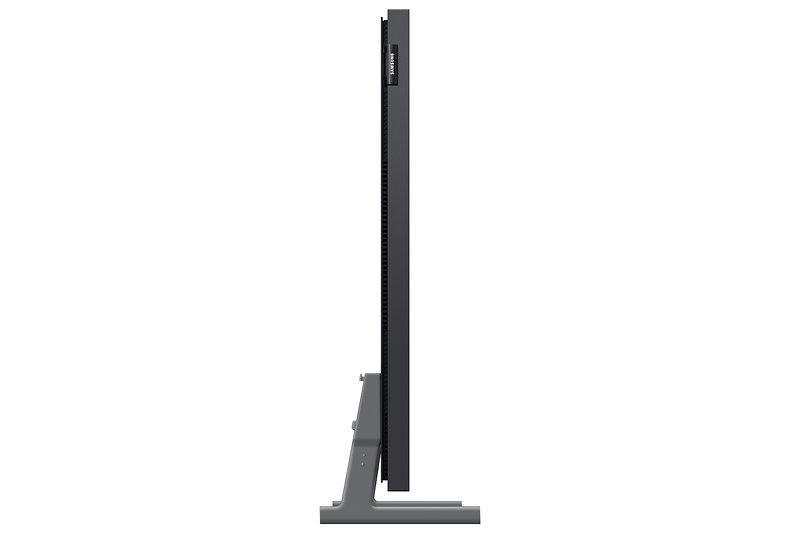 Seitenansicht eines Monitors, der auf einer grauen Basis steht. Der Monitor ist schwarz.