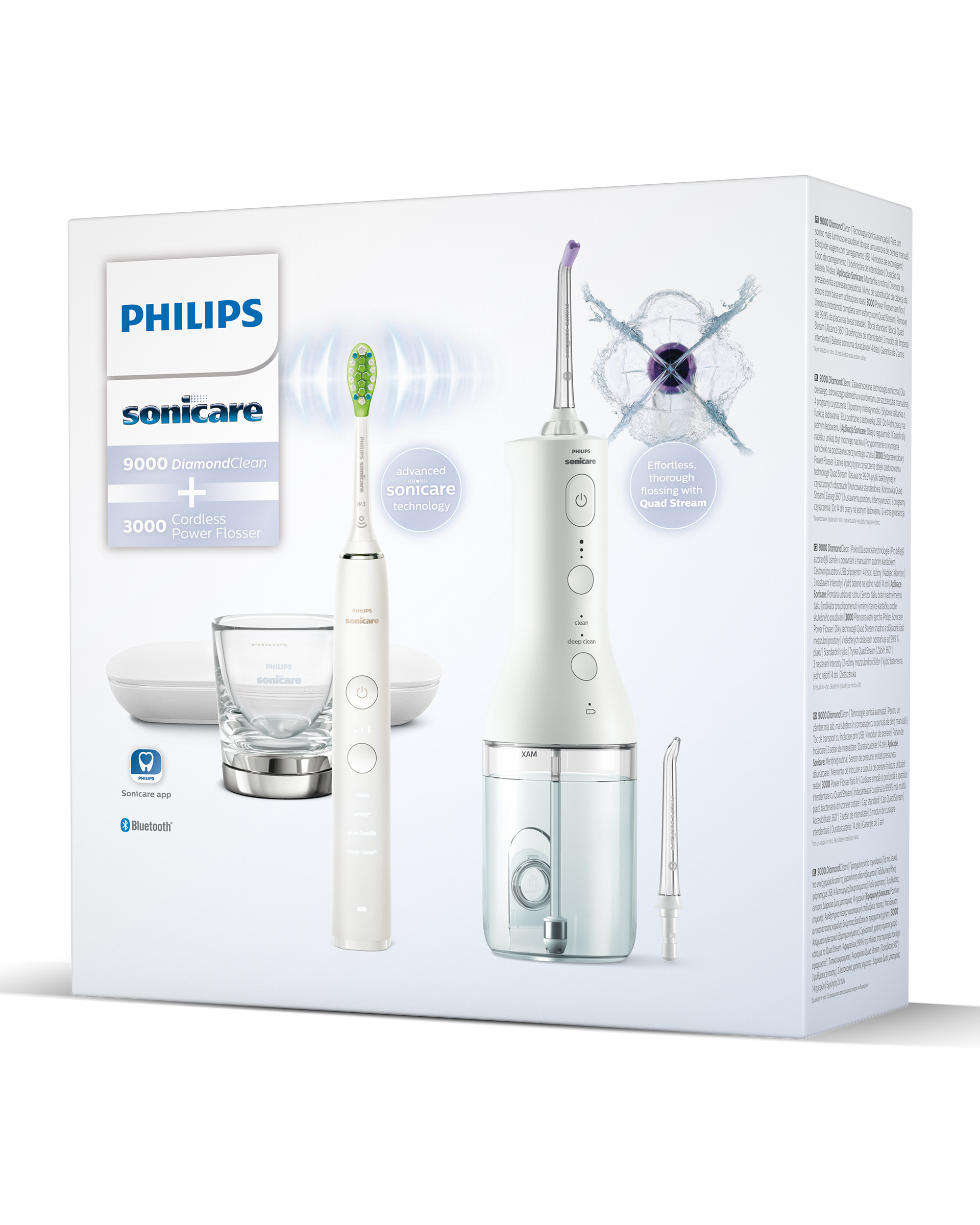 Un ensemble de brosse à dents électrique blanche et de jet dentaire avec accessoires.