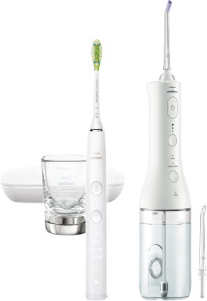 Brosse à dents électrique blanche, hydropulseur et verre.
