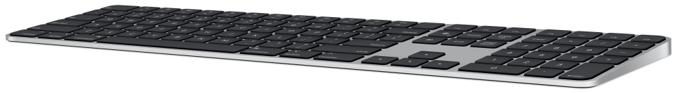Una tastiera Apple argentata con tasti neri, tastierino numerico e cornice argentata.