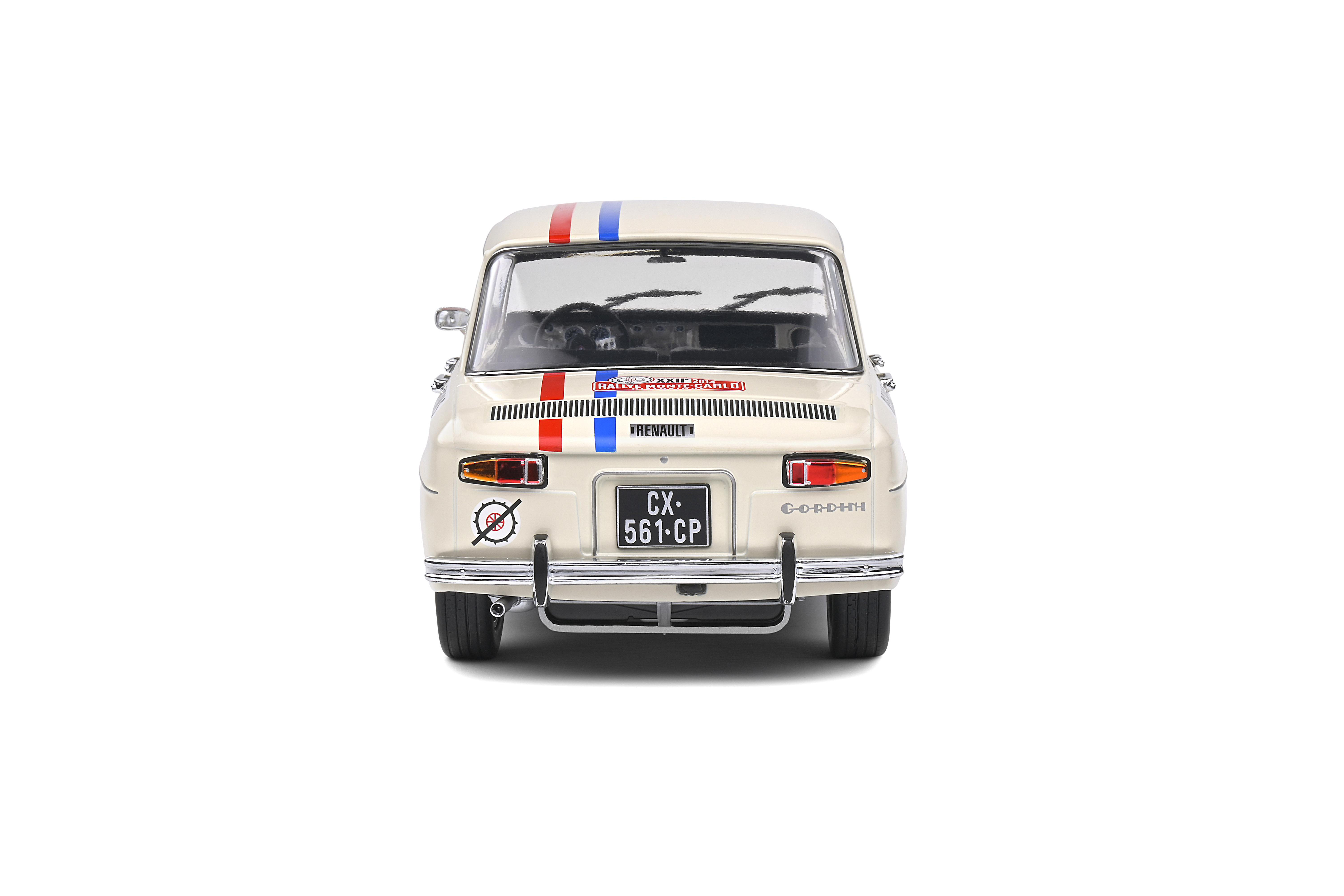 Rückansicht eines cremefarbenen Oldtimers mit Rennstreifen und Nummernschild vor weißem Hintergrund.