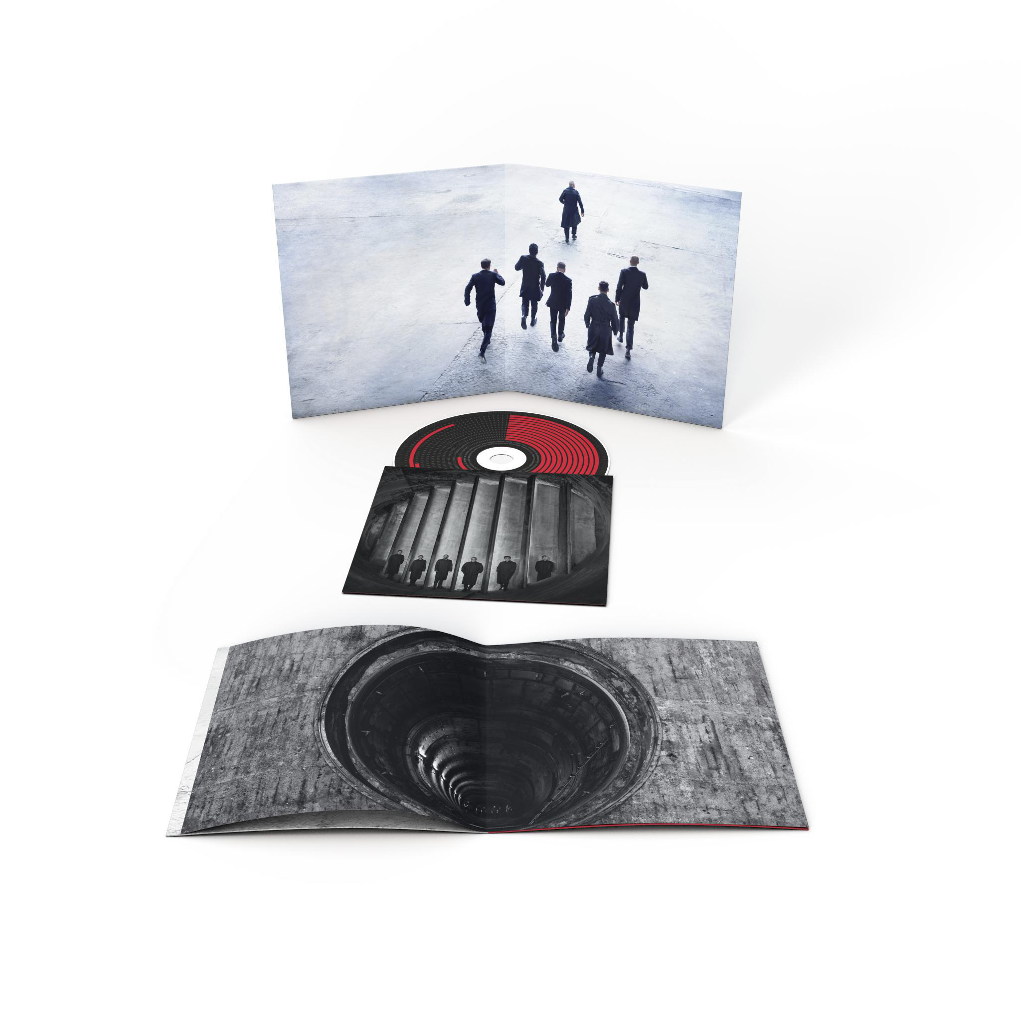 Album mit offenen Seiten, die eine Schallplatte und ein tunnelartiges Bild im Inneren zeigen.