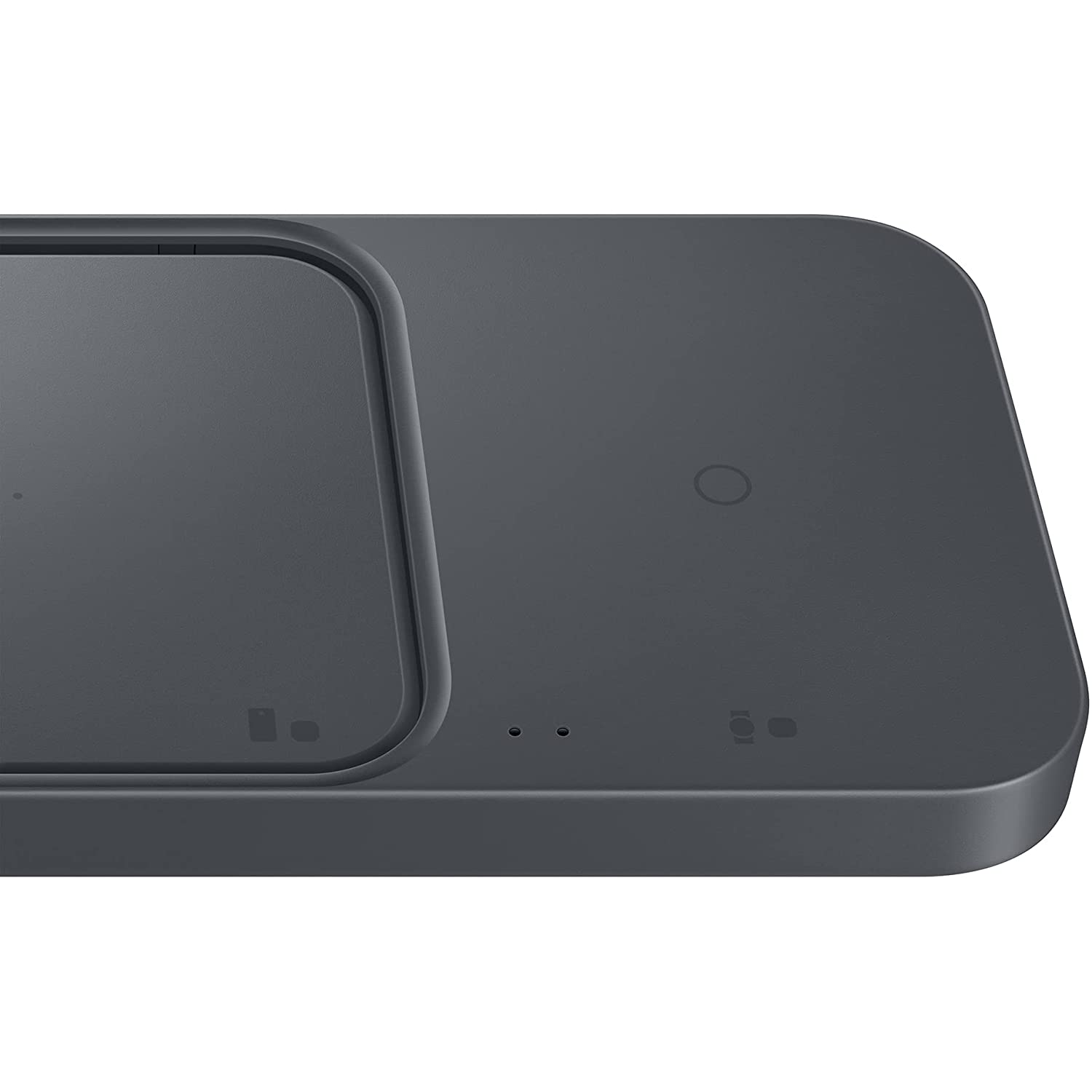 Una base de carga inalámbrica gris oscuro con un área de carga con forma de teléfono y luces indicadoras.
