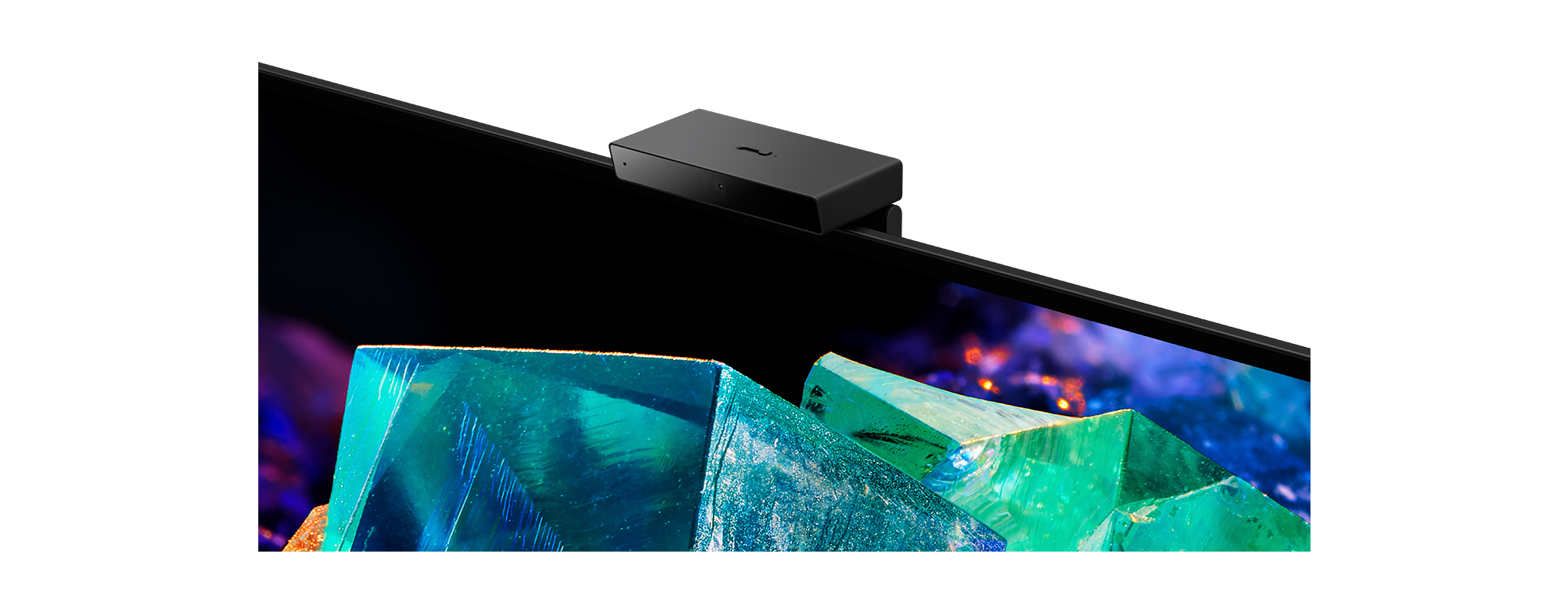 Fernseher mit schwarzem Rahmen und schwarzer Box oben auf dem Bildschirm.