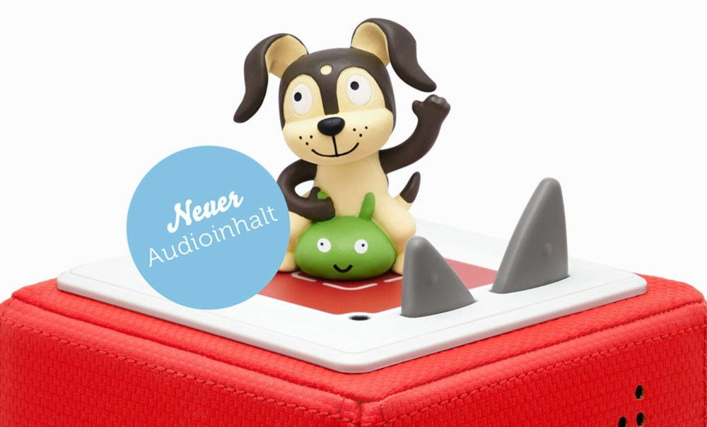 Hundespielzeug auf roter Basis mit Audioinhalt. Zwei Haifischflossen sind vorhanden.