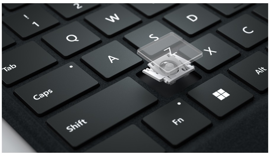 Close-up of a keyboard with a key removed, showing the internal mechanism.