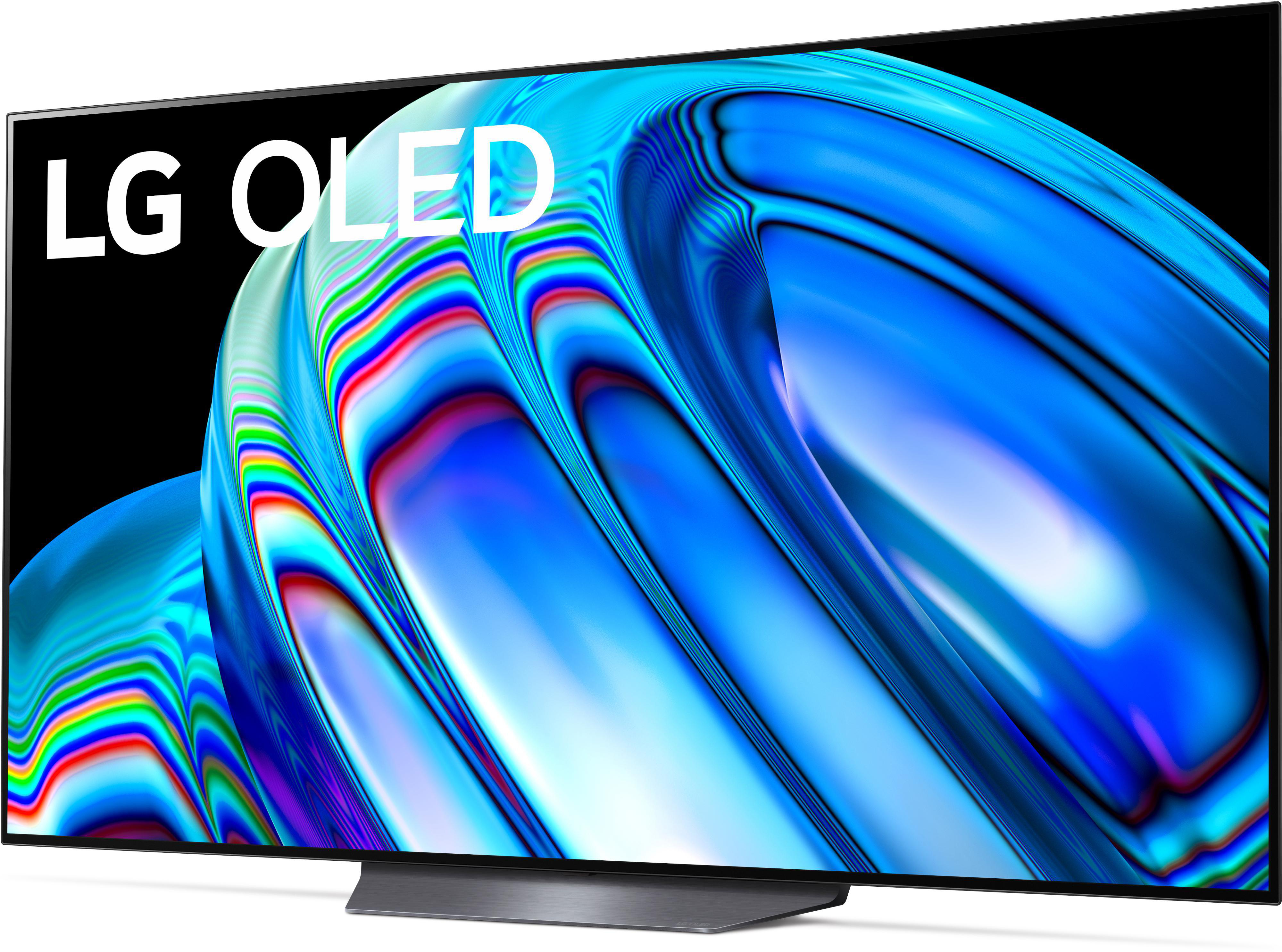 Ein gebogener LG OLED-Fernseher zeigt ein blaues und weißes abstraktes Muster.