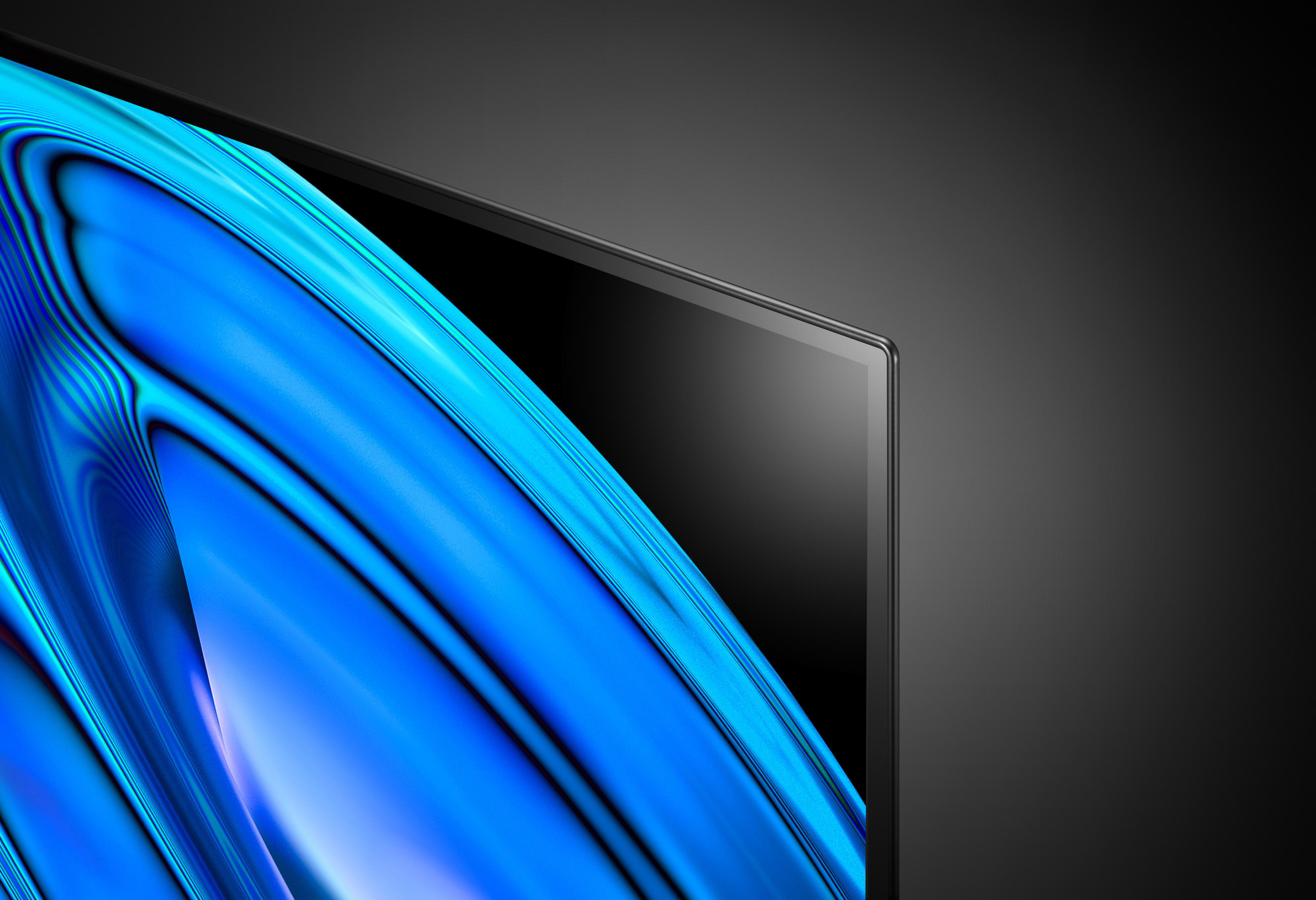 Nahaufnahme eines Fernsehbildschirms mit blauen und weißen Wellen, mit schwarzem Rahmen und Hintergrund.