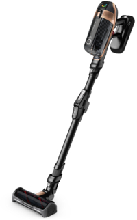 Un aspirapolvere cordless nero e oro rosa su sfondo bianco. L'aspirapolvere è in posizione verticale.