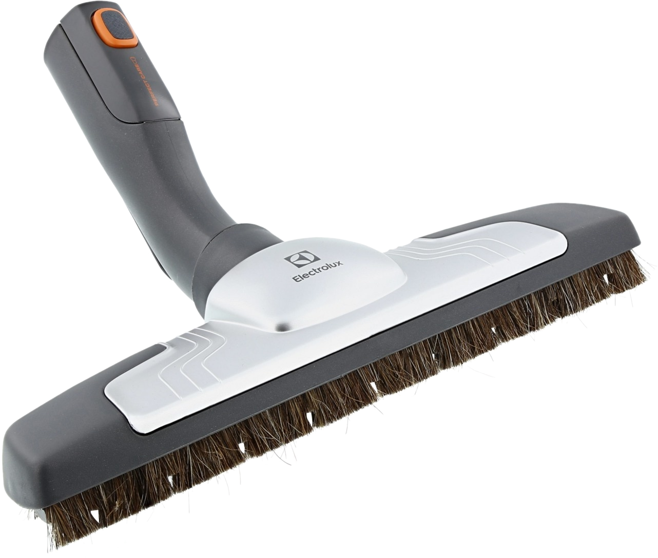 Une tête d'aspirateur Electrolux. Elle est grise et blanche avec des poils bruns.