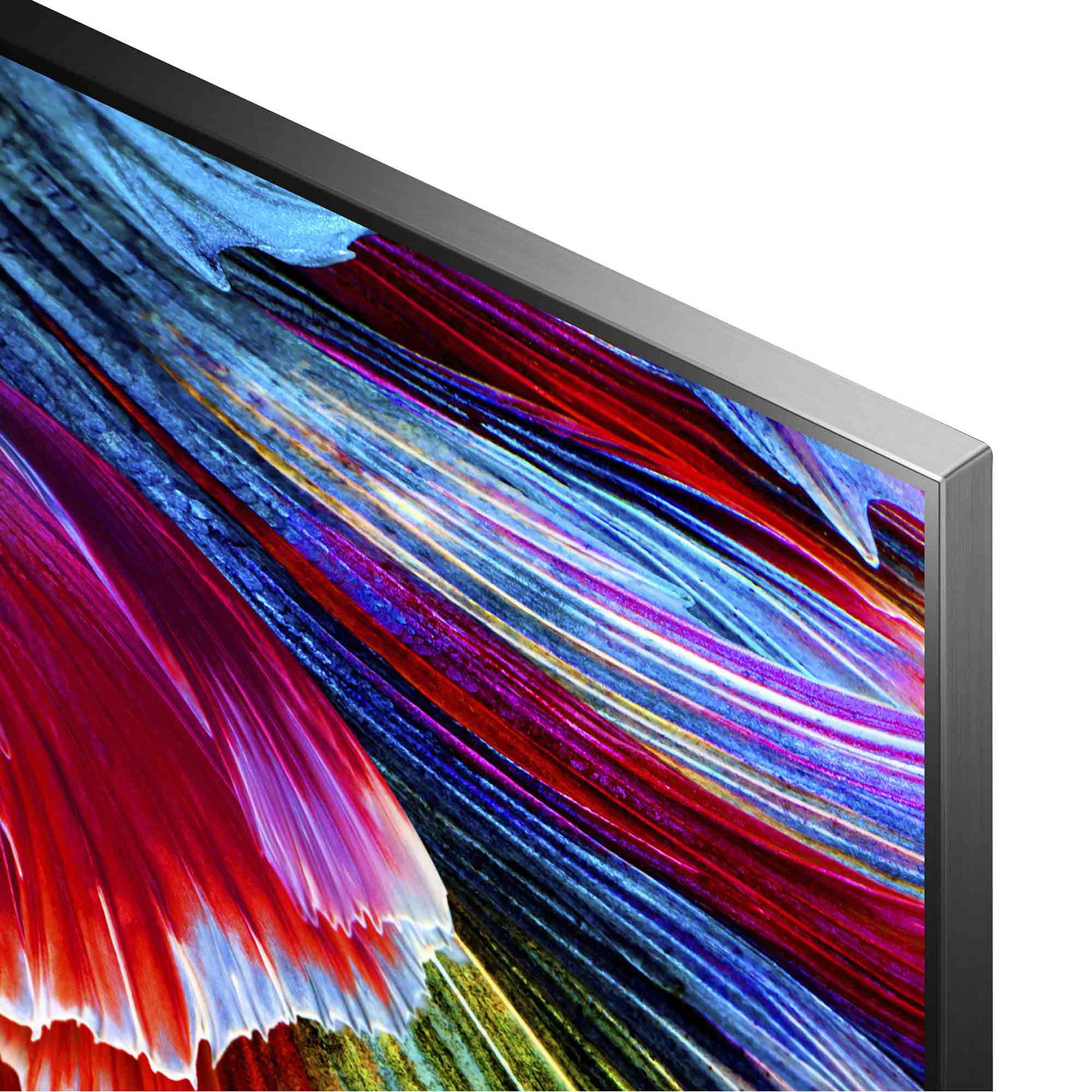 Primer plano de una pantalla de TV con obras de arte abstractas y coloridas. El marco del televisor es plateado. La obra tiene trazos rojos, azules y amarillos.