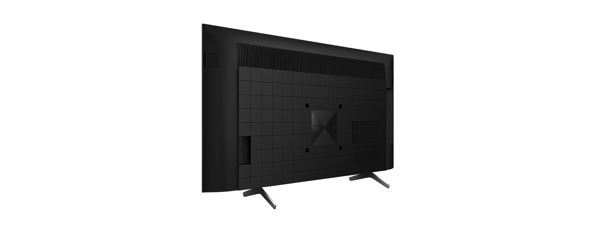Rückseite eines schwarzen Fernsehers mit gitterartigem Muster und abgewinkelten Beinen, vor schwarzem Hintergrund.