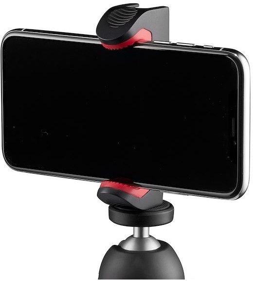 Téléphone noir dans un support sur un trépied.