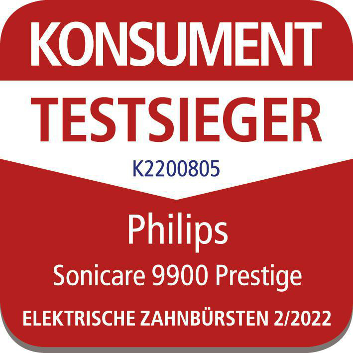 Ein Abzeichen mit der Aufschrift 'Konsument Testseiger' und 'Philips Sonicare 9900 Prestige'.