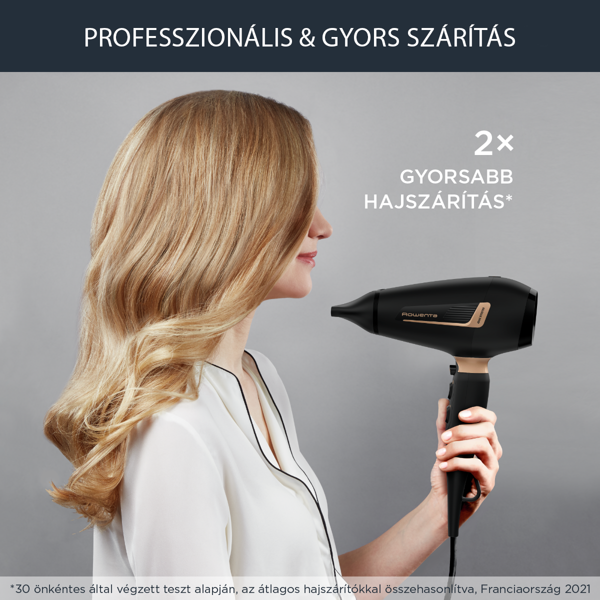 Egy nő fekete-arany hajszárítót használ. A fenti szöveg: 'PROFESSZIONÁLIS ÉS GYORS SZÁRÍTÁS'. Szőke haj fúj.