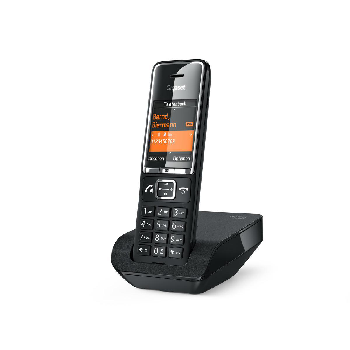 Ein schwarzes schnurloses Telefon auf seiner Basis.