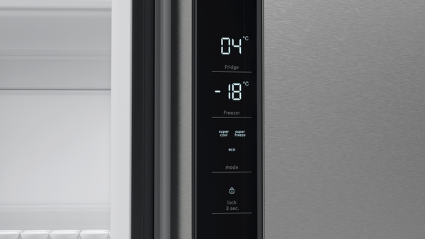 A digital display showing temperature readings and control options, in a silver frame.