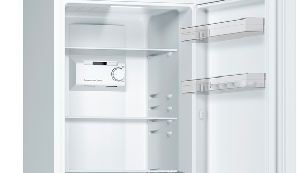 Open refrigerator interior. Shelves, temperature control, and egg storage visible.