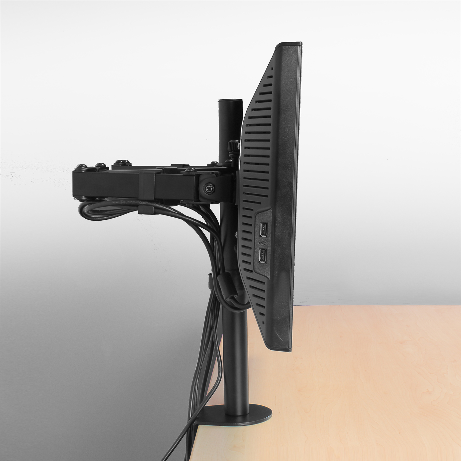 Monitor mounted on a stand. Cables and connections are visible.