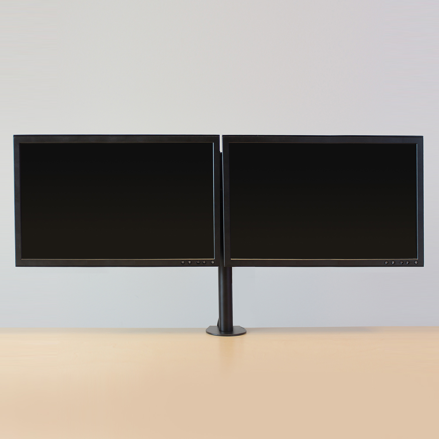 Two black computer monitors side by side, mounted on a stand.