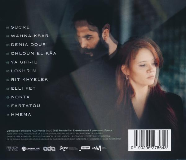 CD-Hülle mit zwei Personen. Text auf Französisch und ein Barcode. Dunkler Hintergrund.