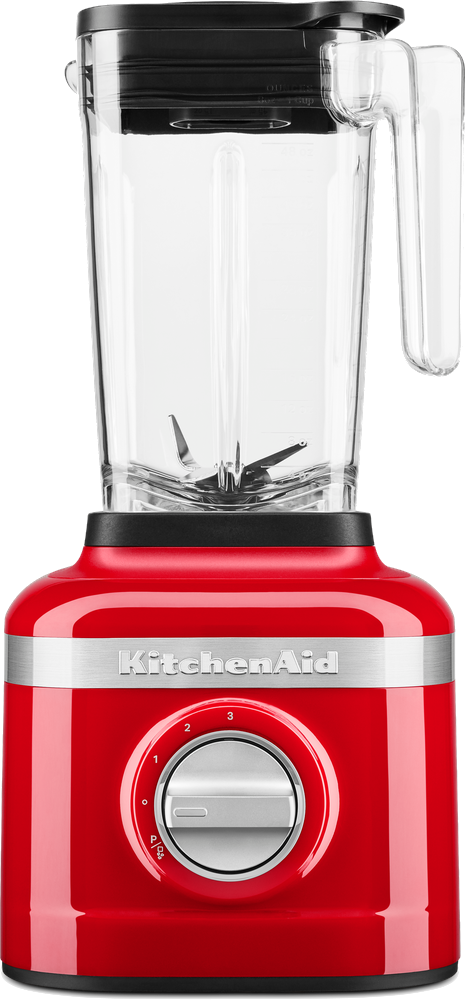 Un blender KitchenAid rouge avec un dessus noir. Le blender a un récipient transparent.