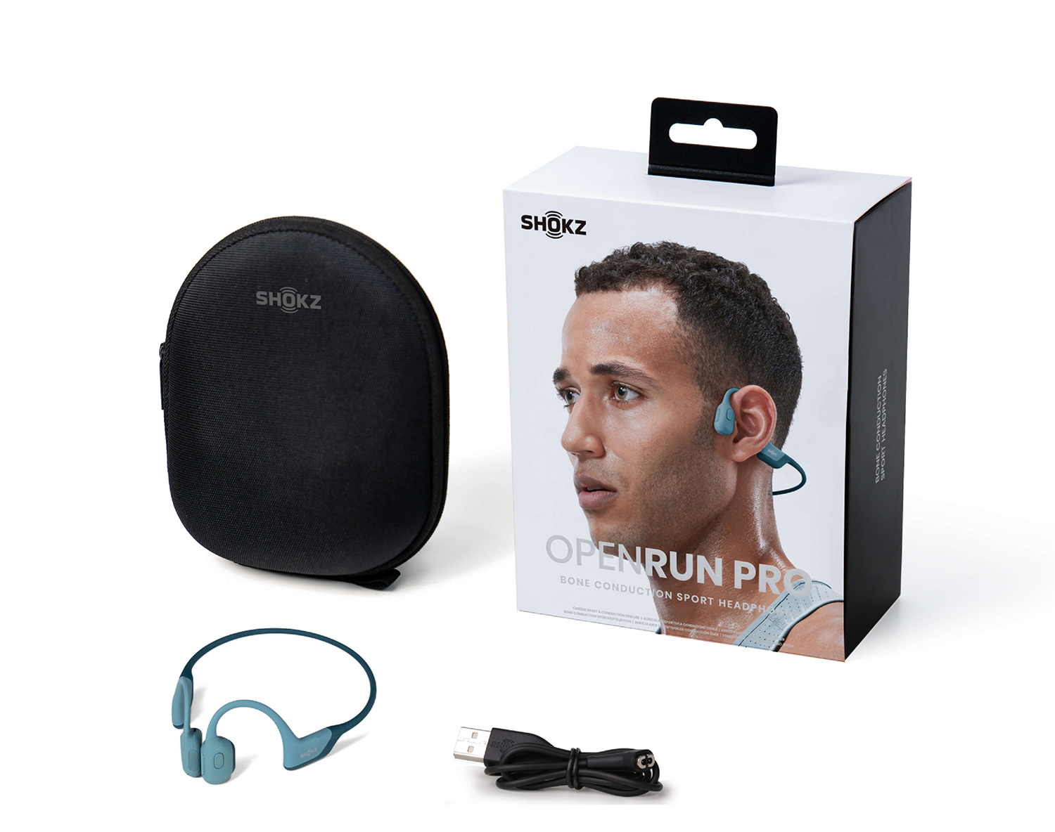 Box and accessories for Shokz OpenRun Pro headphones. A man is shown wearing the headphones.