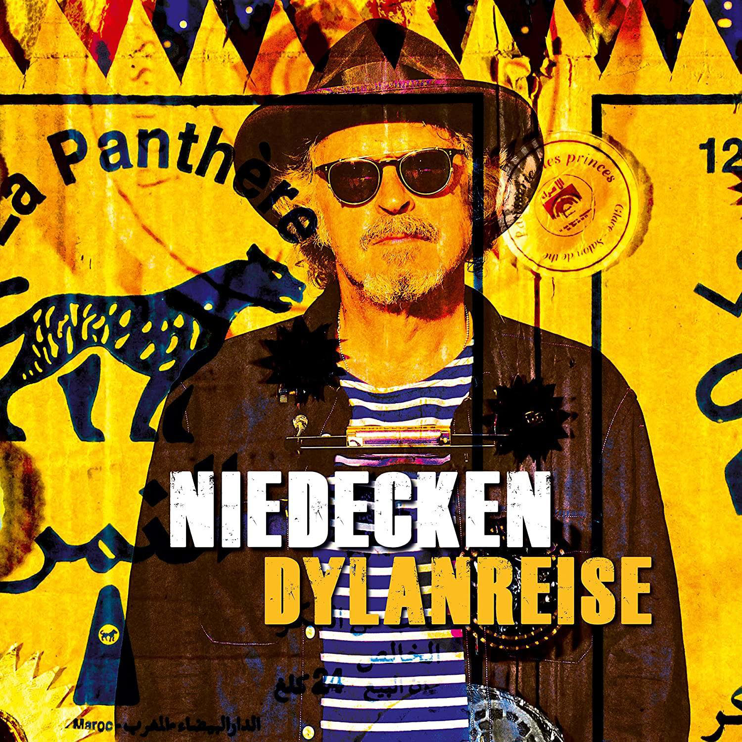 Albumcover mit Mann mit Sonnenbrille, Text 'NIEDECKEN DYLANREISE' und Panther-Grafik.