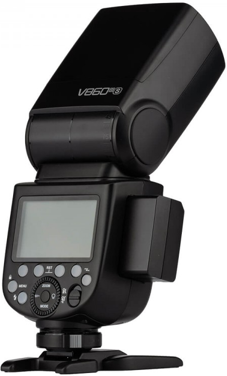 Flash d'appareil photo noir avec écran, boutons et batterie attachée.