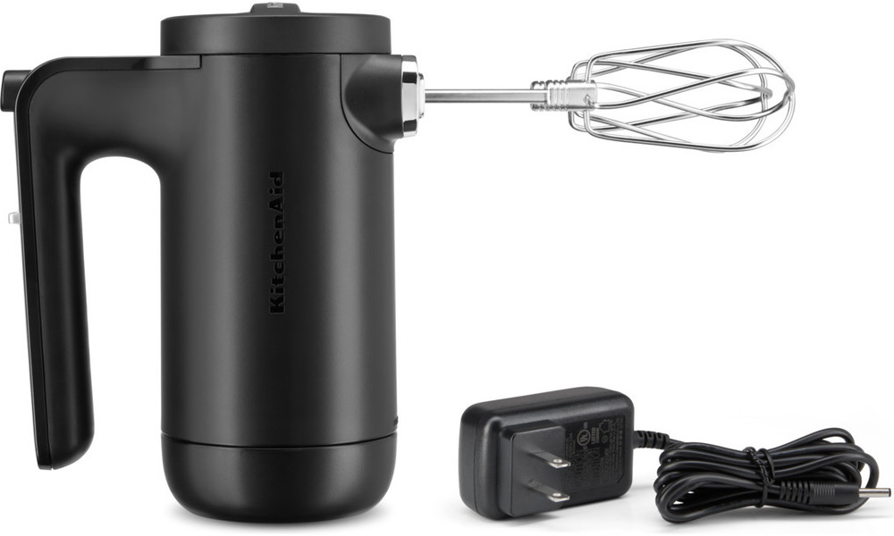 Black KitchenAid hand mixer with charger. The mixer has a handle, and a beater attached.
