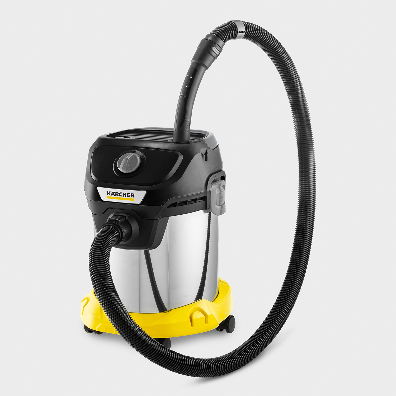 Aspirapolvere giallo e nero. Corpo argentato, tubo nero, base gialla, manico nero.