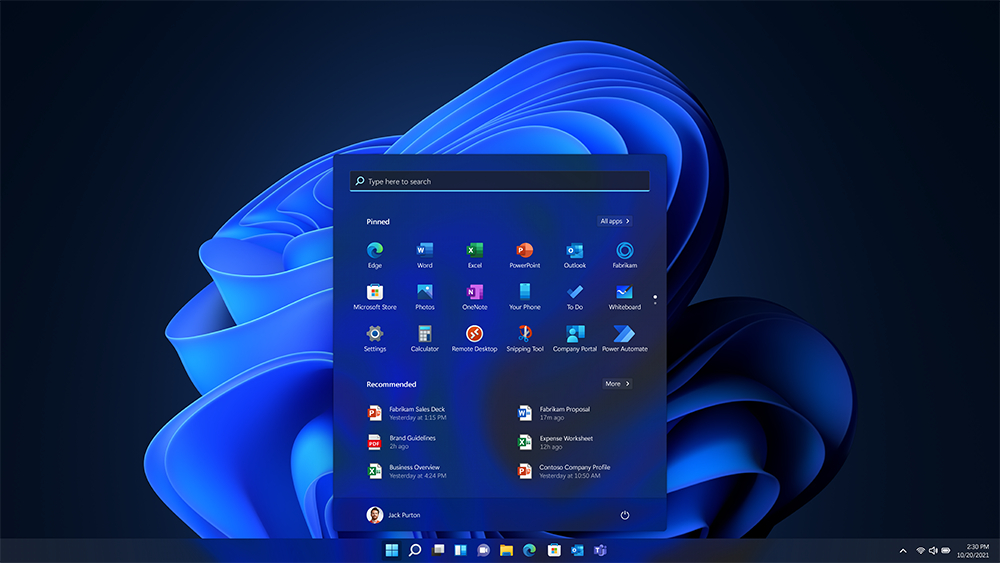 Ein Windows 11-Desktop mit dunkelblauem Hintergrund und geöffnetem Startmenü.