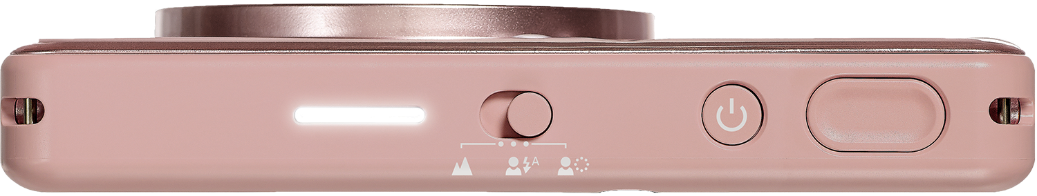 The bottom of a pink instant camera, showing a light, switch, and power button.