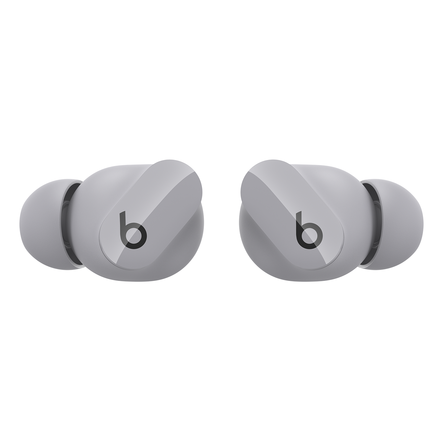 Dos auriculares Beats grises, angulados para mostrar el logotipo de la marca, sobre fondo negro.