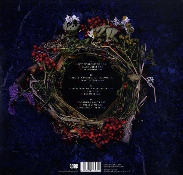 CD-Cover, floraler Kranz mit Titelliste auf dunkelblauem Hintergrund.