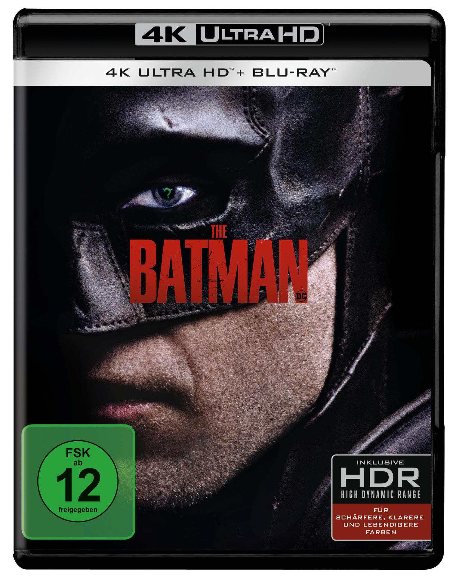 DVD-Cover für 'The Batman'. Nahaufnahme von Batmans Gesicht mit dem Titel. Schwarzer Hintergrund.